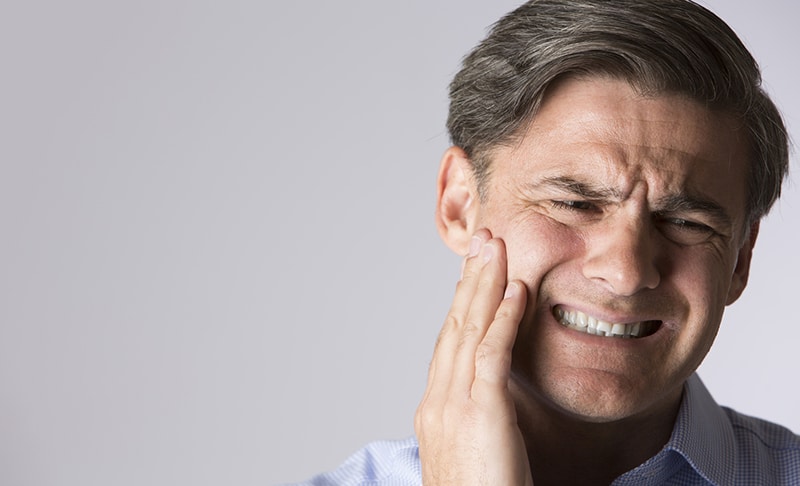 Man in apparent jaw pain