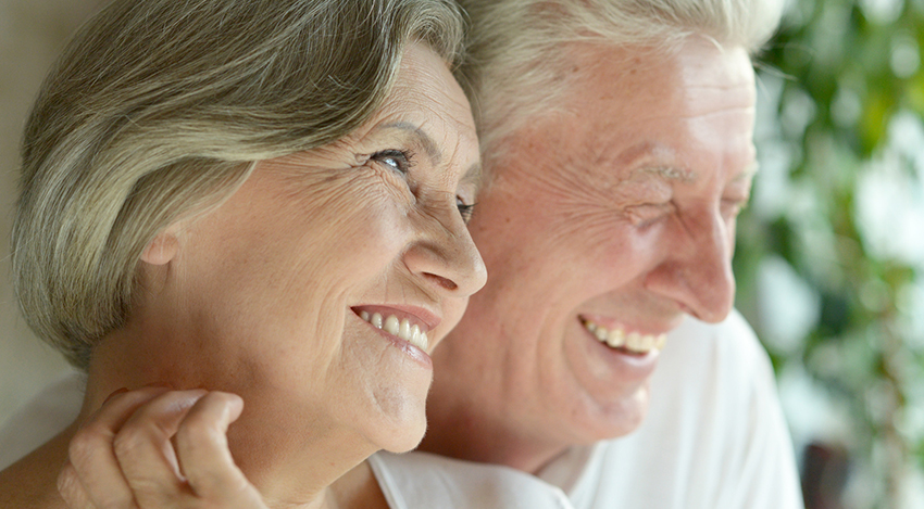 Senior Couple enjoying their smiles after oral surgery in Rochester New York